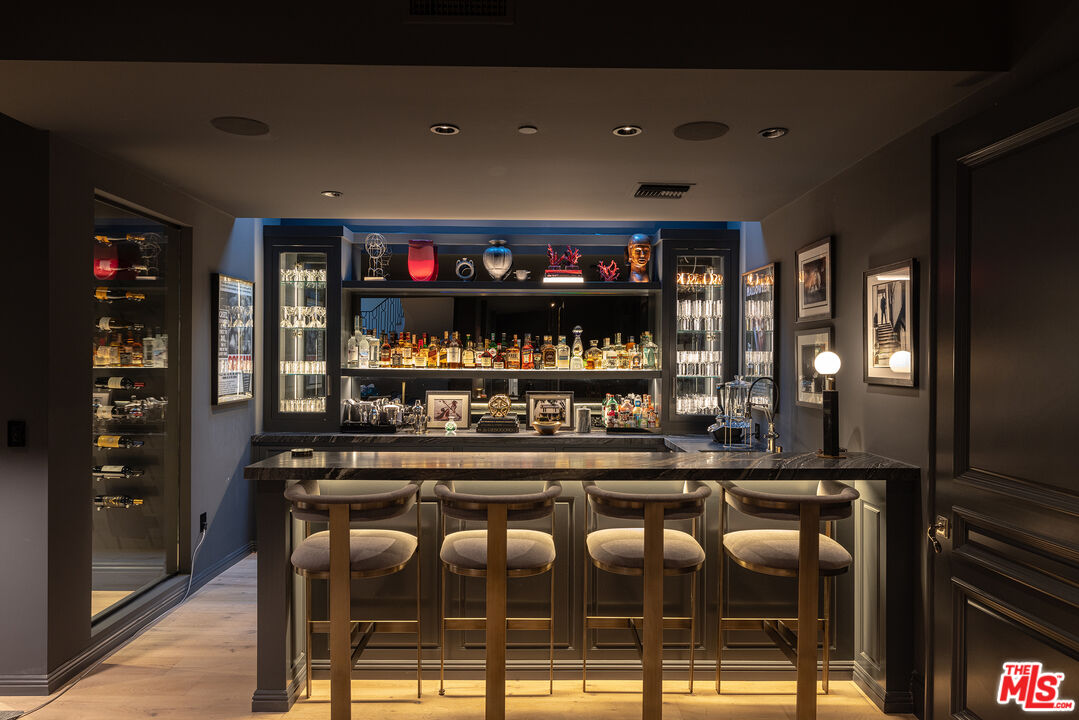 9520 Hidden Valley Road Beverly Hills, CA 90210 - Photo 21 of 29 a kitchen with a counter space cabinets and appliances