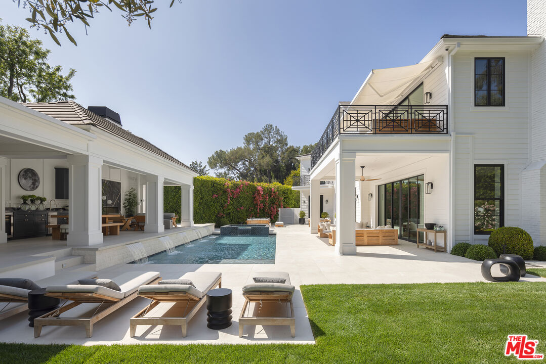 9520 Hidden Valley Road Beverly Hills, CA 90210 - Photo 7 of 29 a view of a house with backyard porch and sitting area