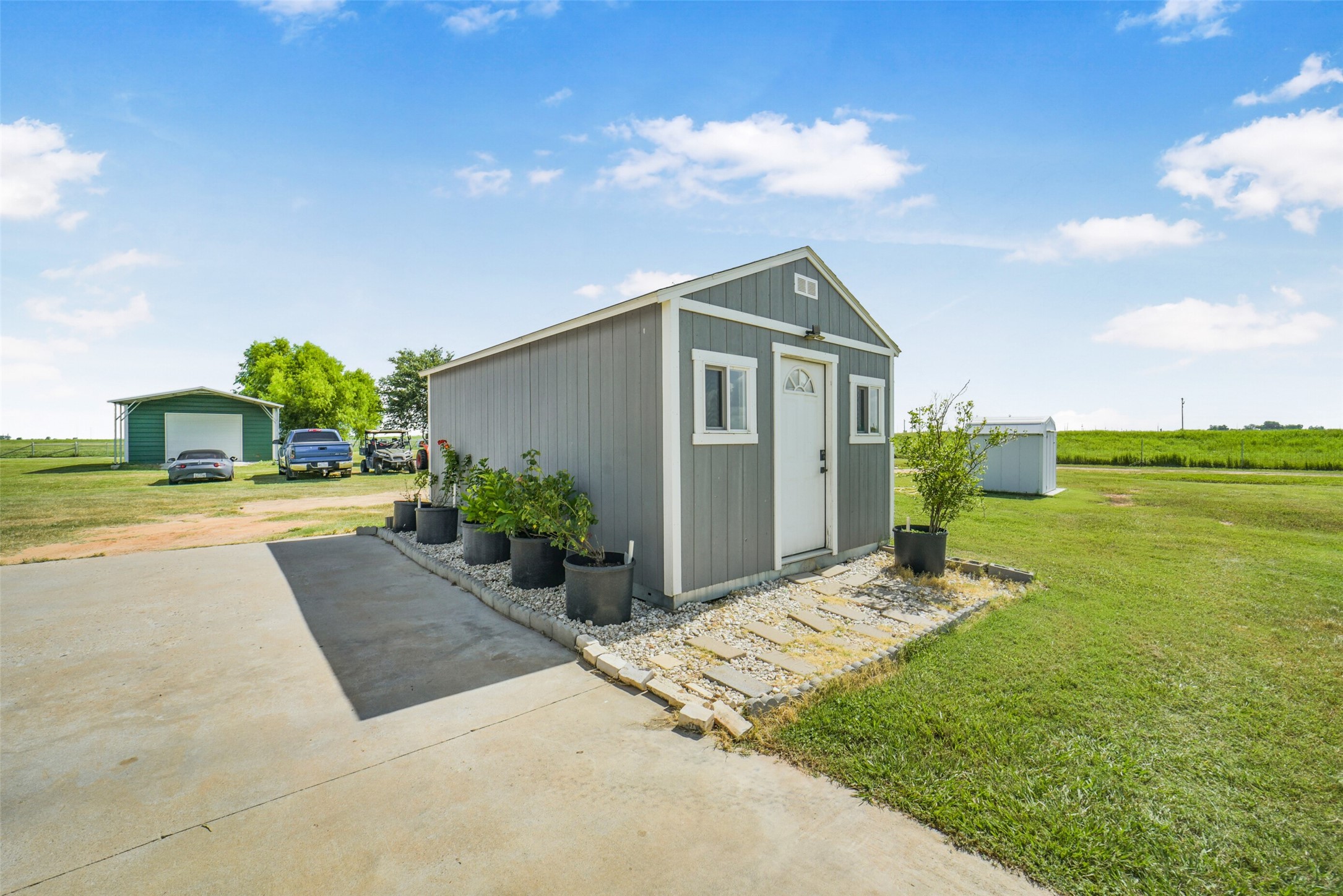 11301 South FM 441 Road El Campo, TX 77437 - Photo 24 of 43 This property features a small, gray 12x20 ToughShed storage shed.