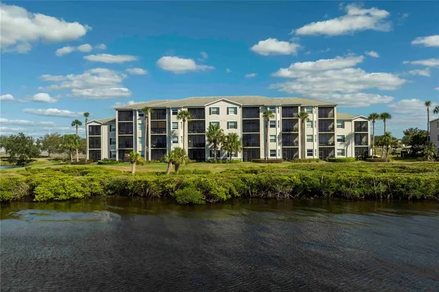 an aerial view of house with yard swimming pool and outdoor seating