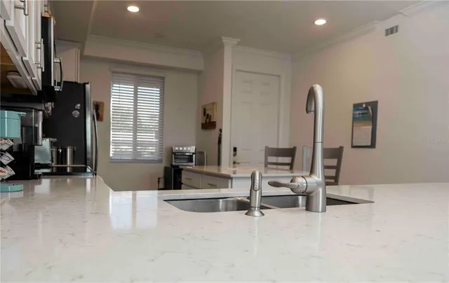 a living room with furniture a lamp and a fireplace