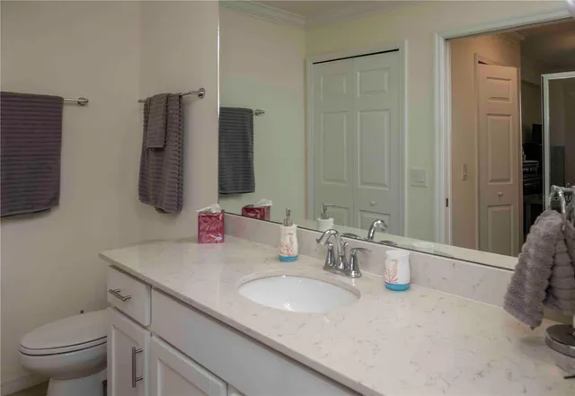 a bathroom with a sink and mirror