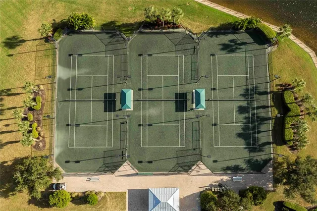 an aerial view of a house with a yard