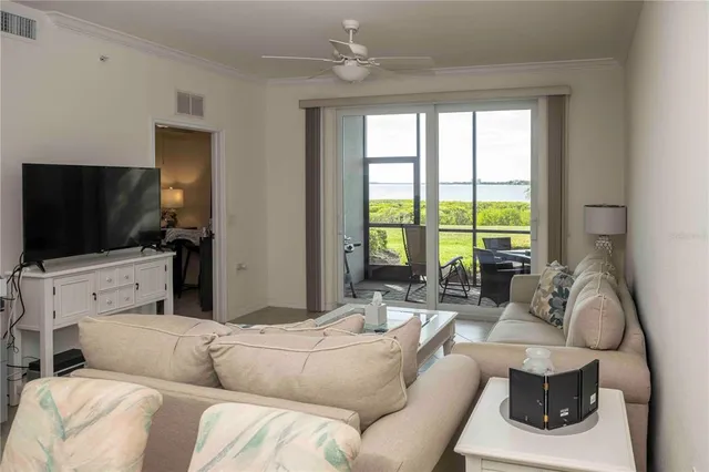 a kitchen with stainless steel appliances kitchen island granite countertop a refrigerator and a stove top oven