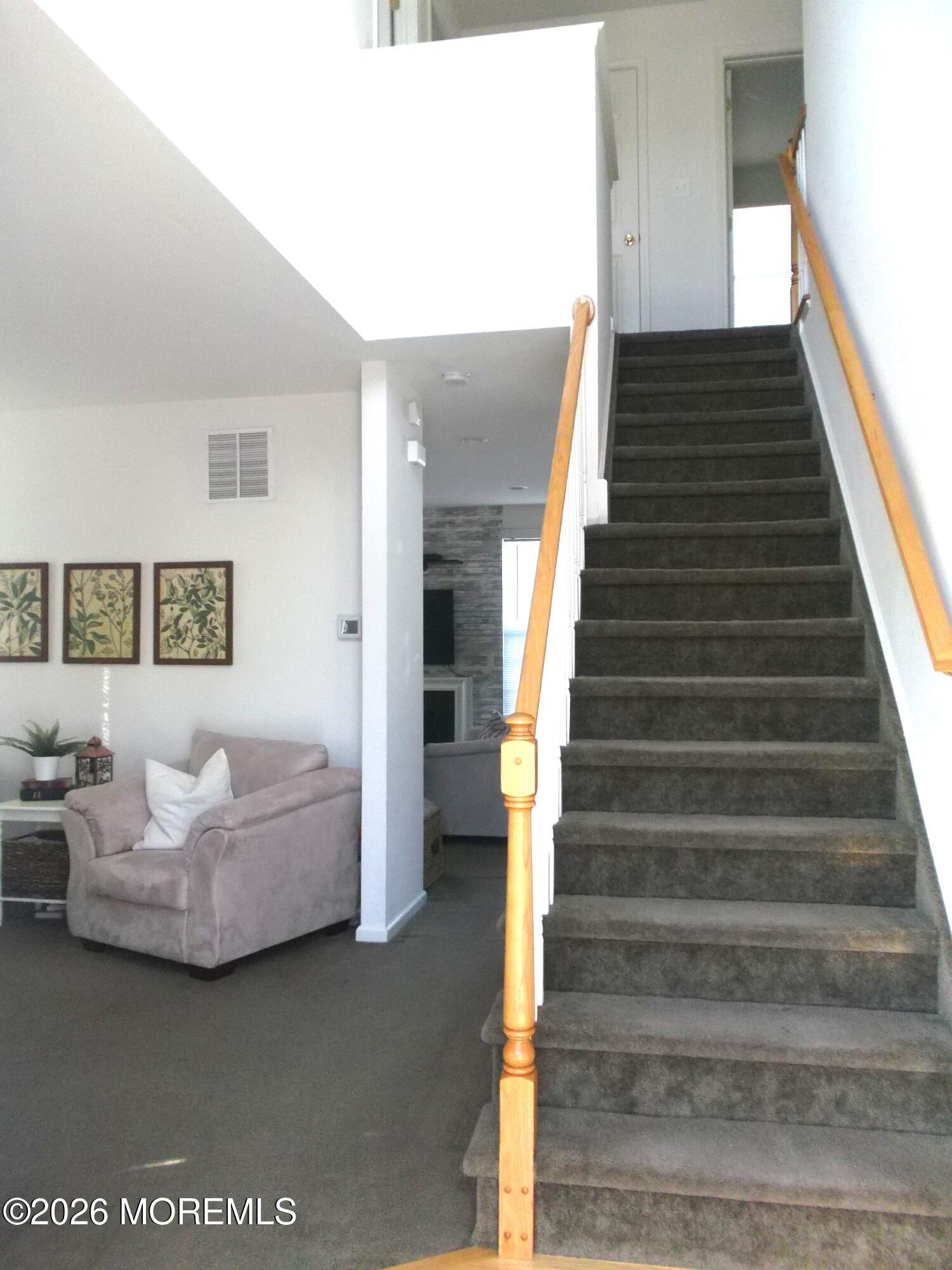 65 Homestead Drive Pemberton, NJ 08068 - Photo 12 of 26 a view of livingroom and dining room with stairs