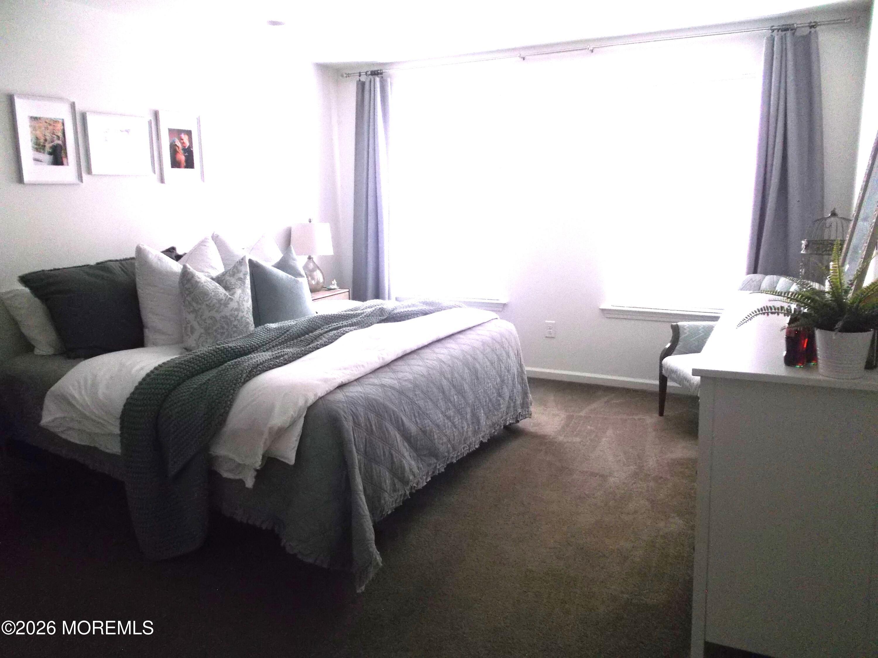 65 Homestead Drive Pemberton, NJ 08068 - Photo 13 of 26 a bed sitting in a bedroom next to a window