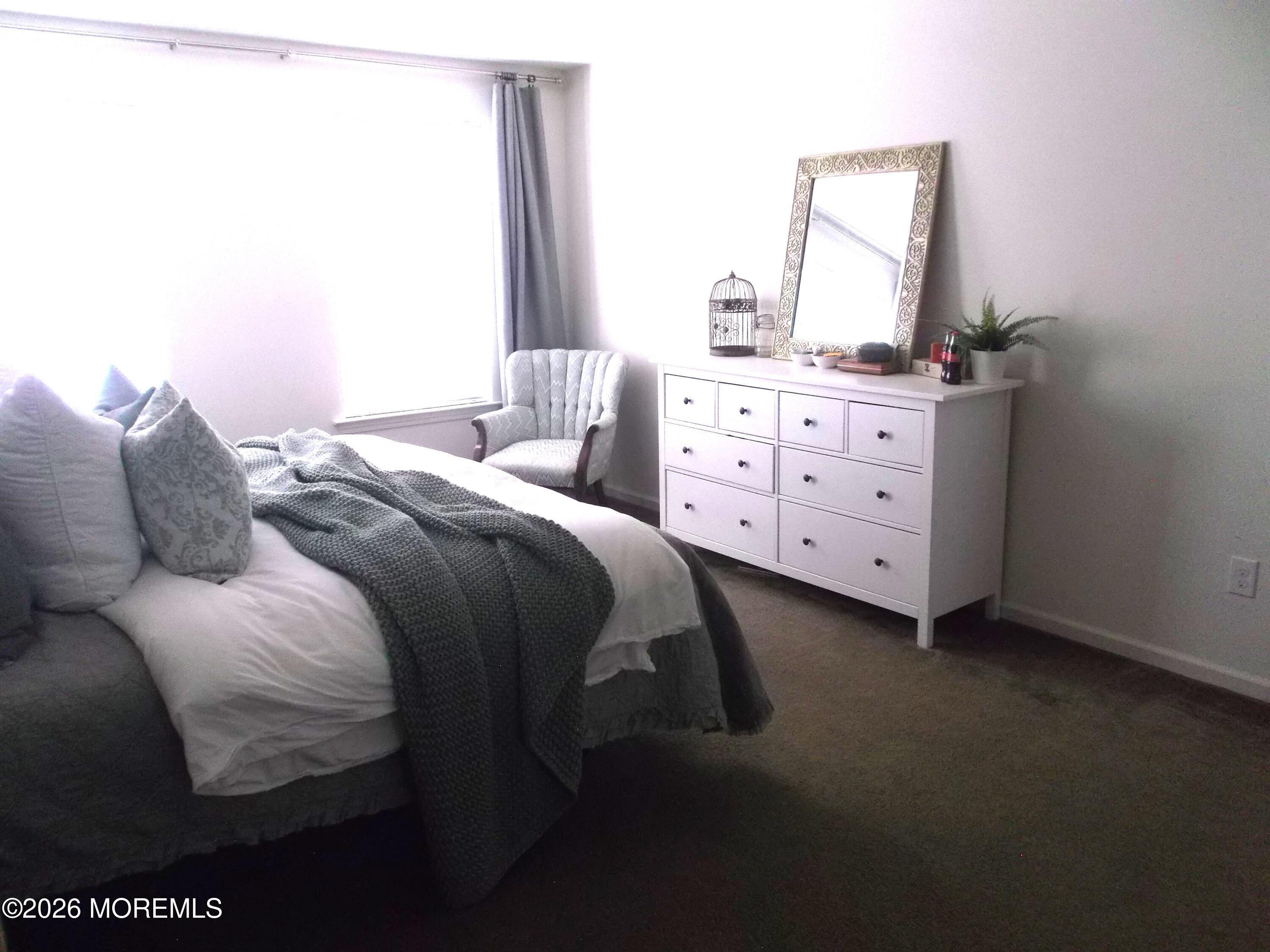 65 Homestead Drive Pemberton, NJ 08068 - Photo 14 of 26 a bedroom with a bed and a dresser