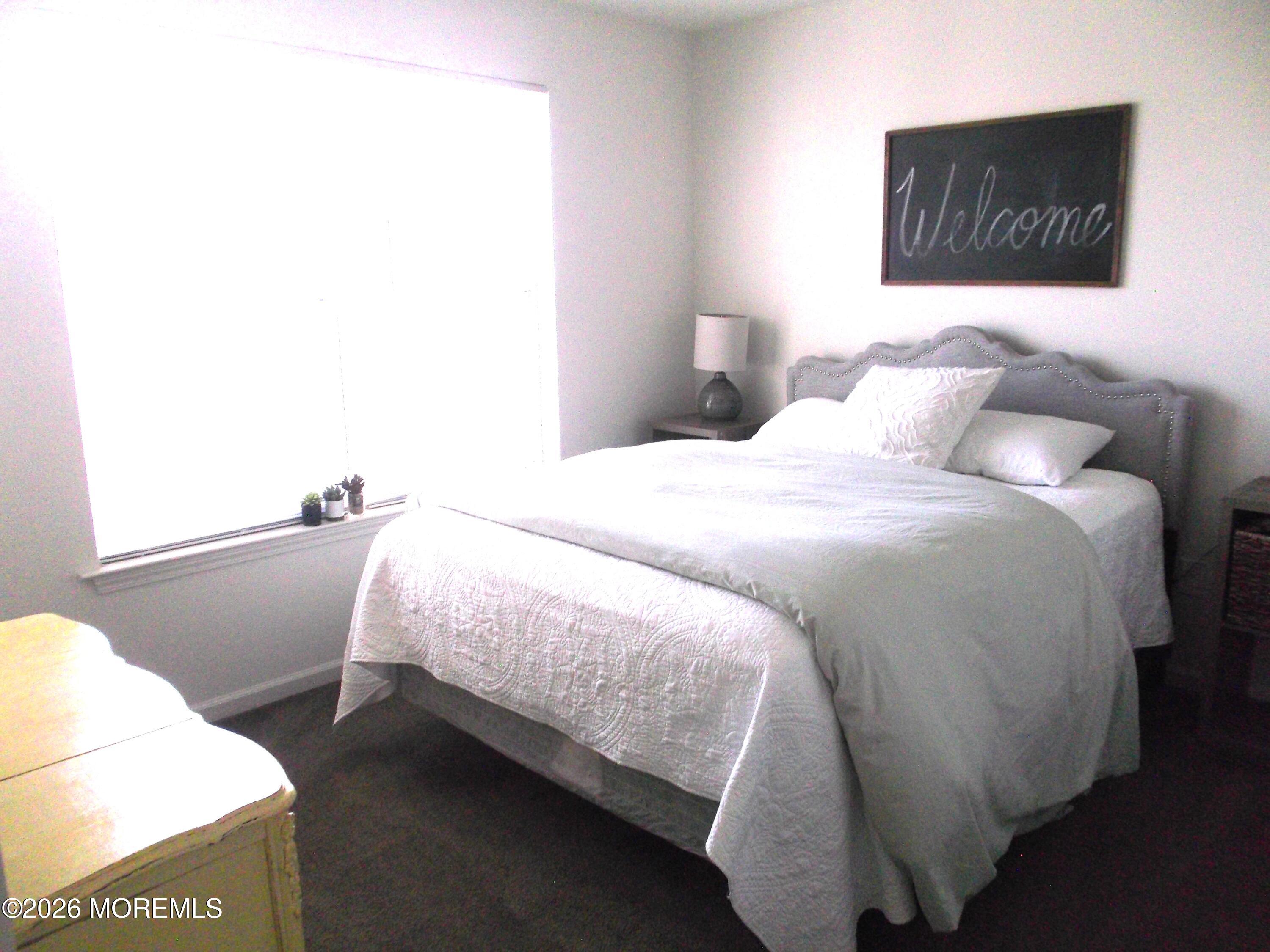 65 Homestead Drive Pemberton, NJ 08068 - Photo 18 of 26 a bedroom with a bed and a night stand