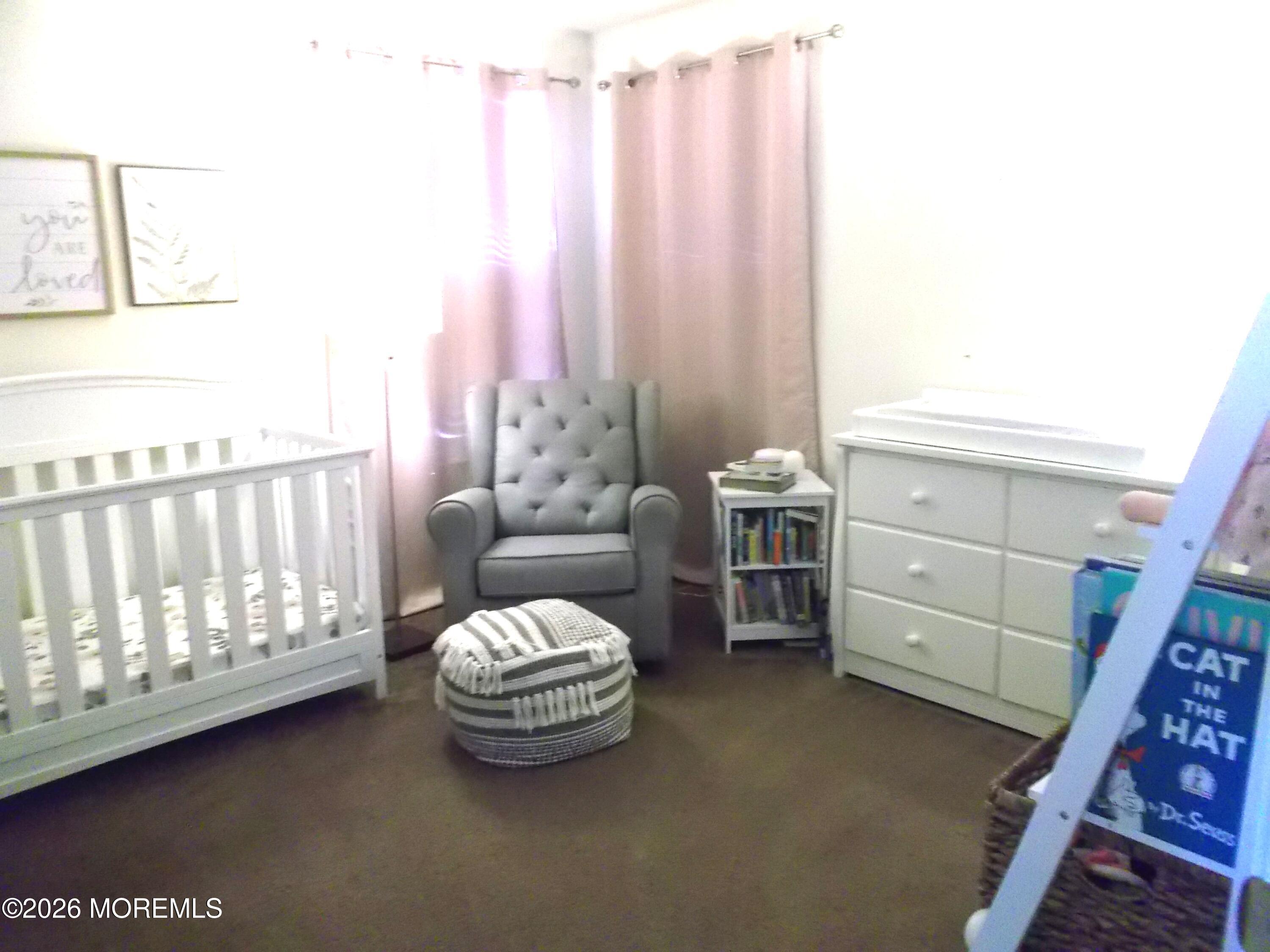 65 Homestead Drive Pemberton, NJ 08068 - Photo 19 of 26 a living room with furniture and a baby crib