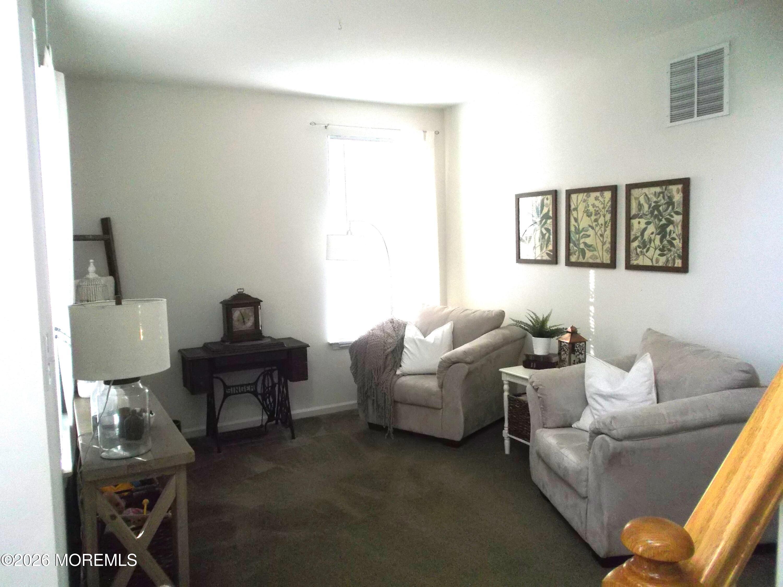 65 Homestead Drive Pemberton, NJ 08068 - Photo 9 of 26 a living room with furniture and a window
