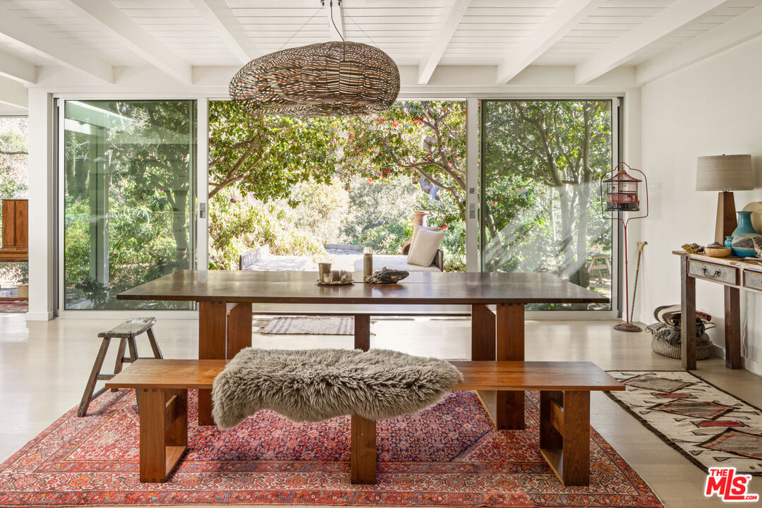 a living room with a large window and table