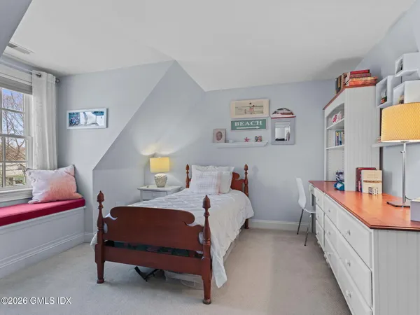 a bedroom with furniture and a bed