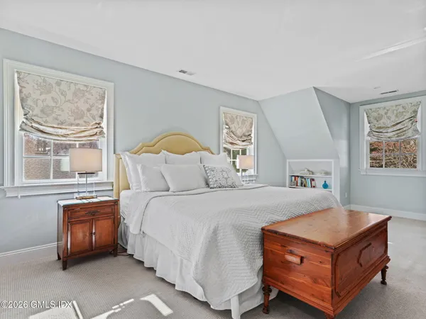 a room with a bed and a window