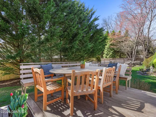 a patio with table and chairs