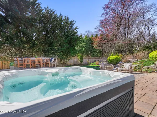 a view of a backyard with sitting area