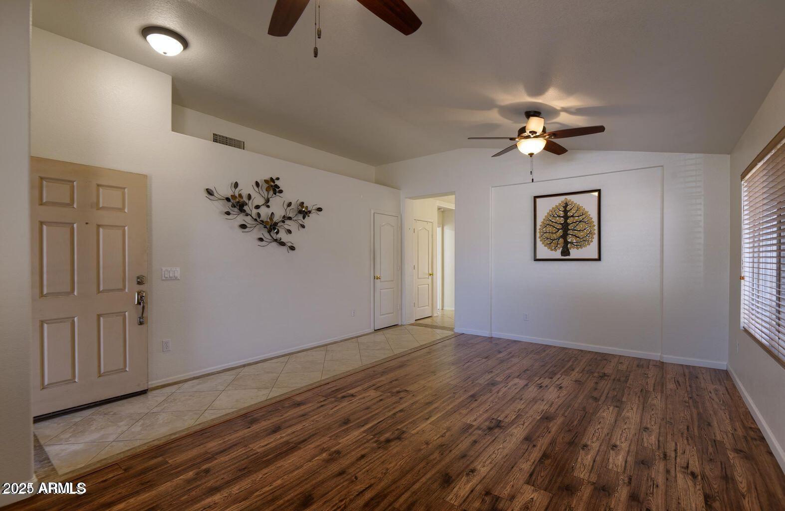 2897 East Terrace Avenue Gilbert, AZ 85234 - Photo 2 of 10 wooden floor in an empty room with a window