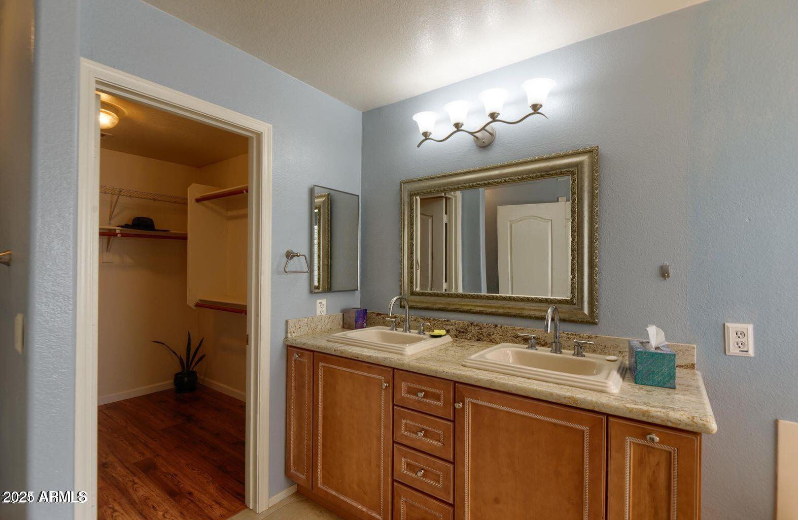 2897 East Terrace Avenue Gilbert, AZ 85234 - Photo 6 of 10 a bathroom with a granite countertop sink double vanity and a mirror