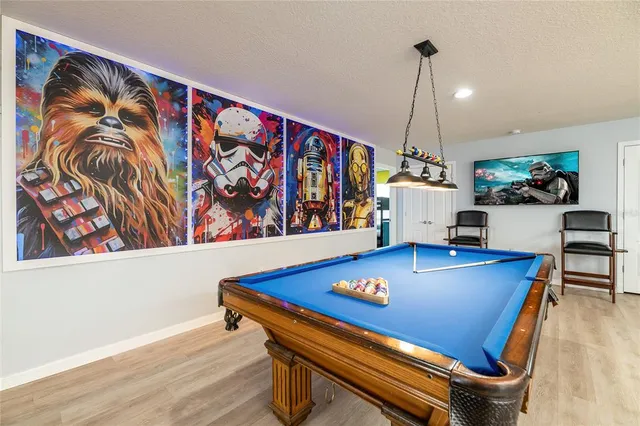 a living room with lots of furniture and a flat screen tv