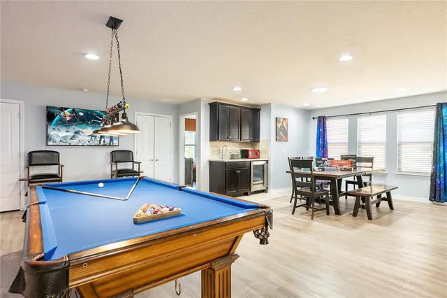 a media room with lots of chairs and a projector screen