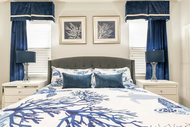 a bedroom with a bed a closet and a window