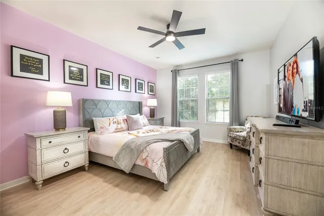 a bedroom with a bed and a lamp