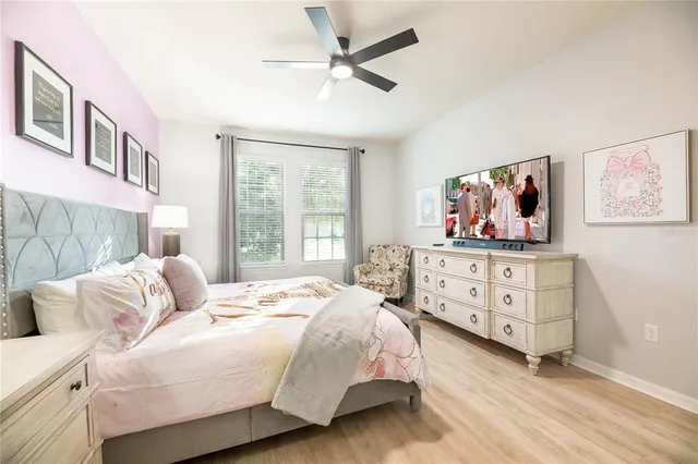 a bathroom with a granite countertop sink a mirror and a shower