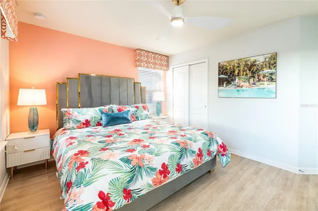 a bathroom with a granite countertop sink a large mirror and a shower