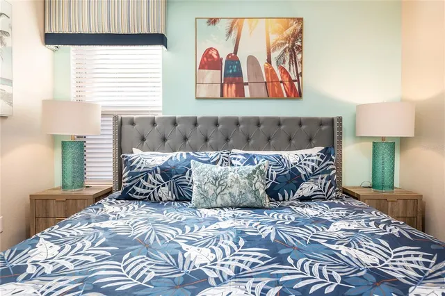 a bedroom with a bed and window