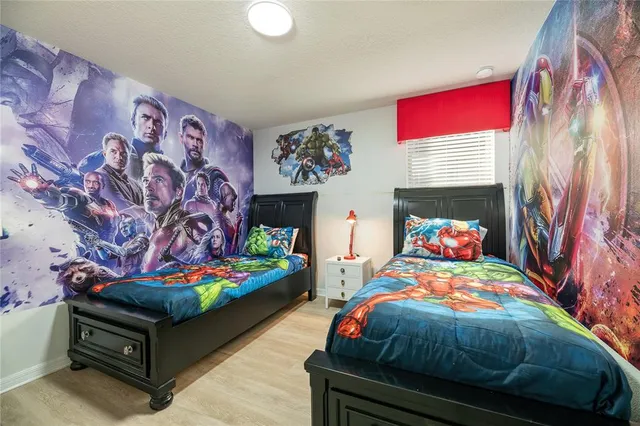 a bathroom with a granite countertop sink a mirror and a shower