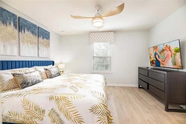 a view of a patio with a dining table and chairs under an umbrella