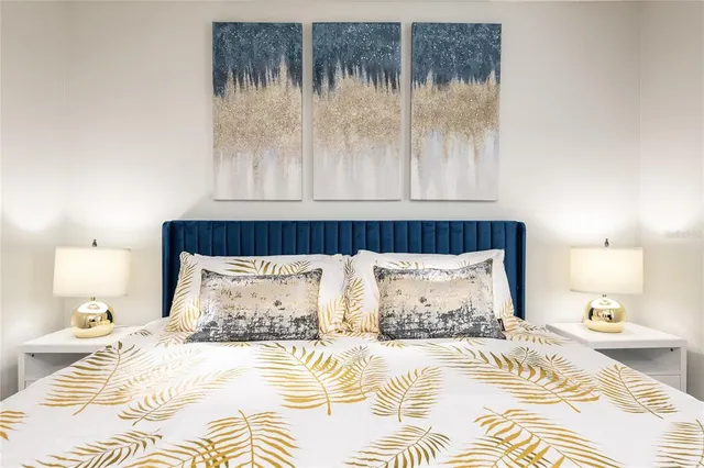 a view of a patio with a table and chairs under an umbrella