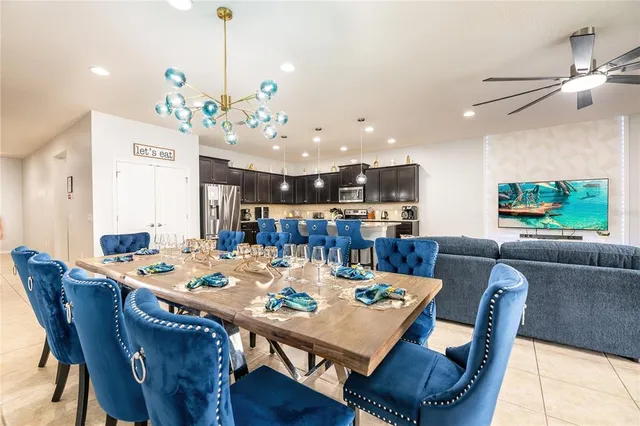 a kitchen with stainless steel appliances granite countertop a sink refrigerator and microwave