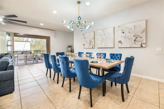 a living room with furniture pool table and a flat screen tv