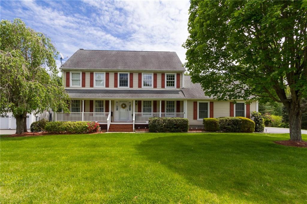 30 Barnum Place Ridgefield, CT 06877 - Photo 1 of 1 a front view of a house with a garden