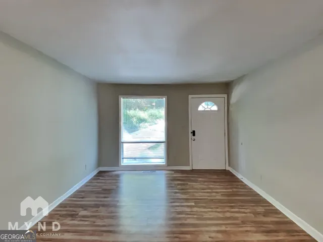 a view of an empty room and window