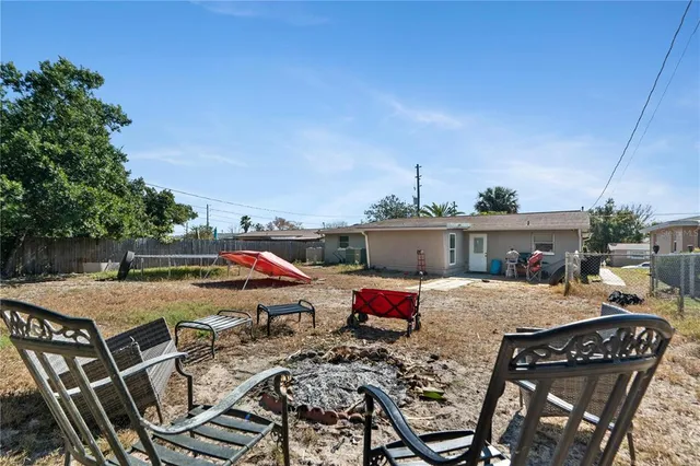 a view of a dinning table and chairs in the patio