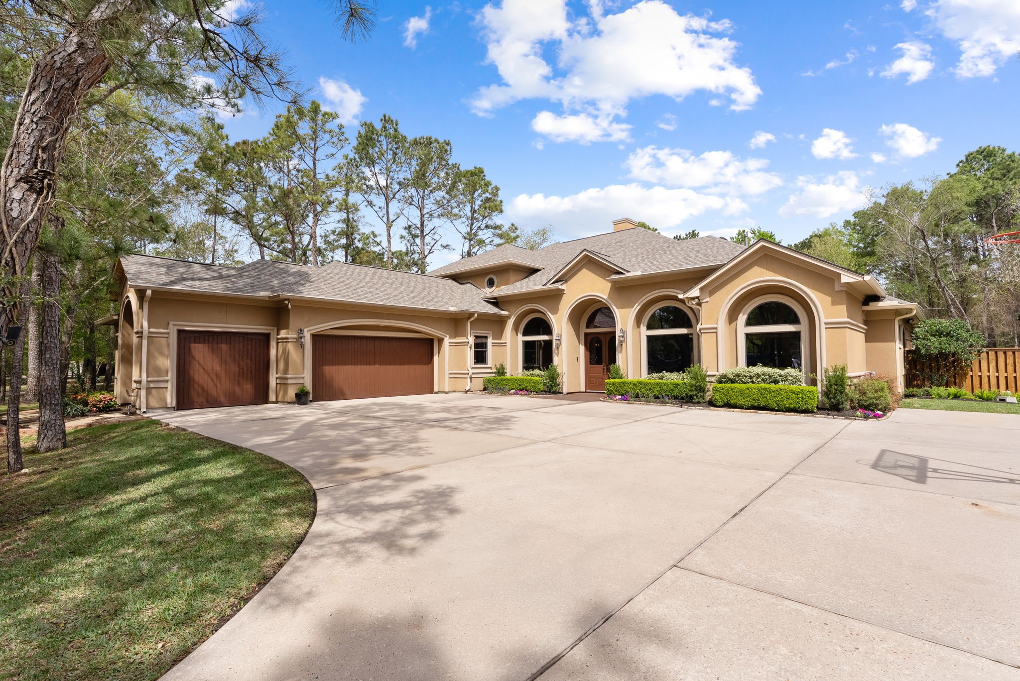 3907 Rayford Road Spring, TX 77386 - Photo 5 of 38 Set on just over an acre in Benders Landing, this custom home is surrounded by mature trees and offers a true sense of privacy from the moment you arrive.