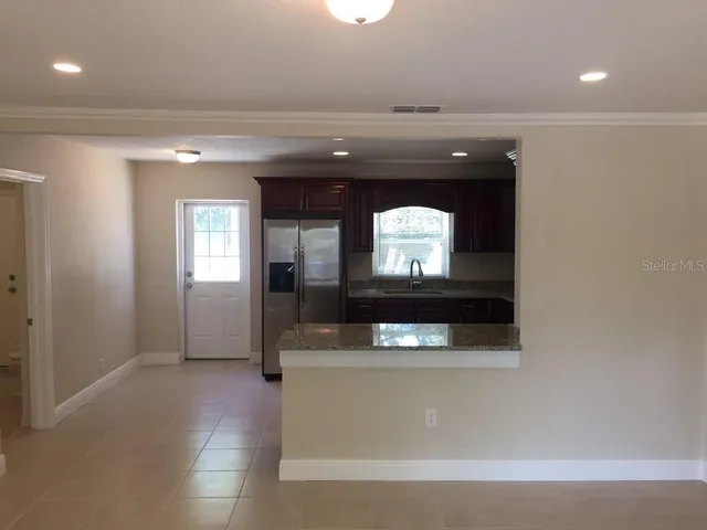 a living room with a couch and a fireplace
