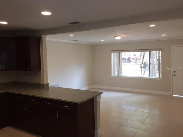 a view of an empty room with a window