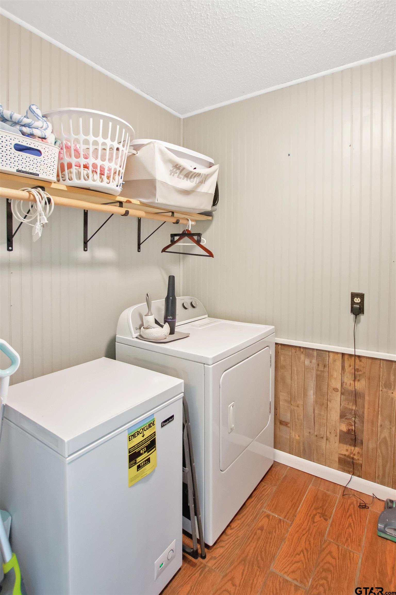 1908 Waunell Drive Tyler, TX 75701 - Photo 11 of 39 a utility room with dryer and washer