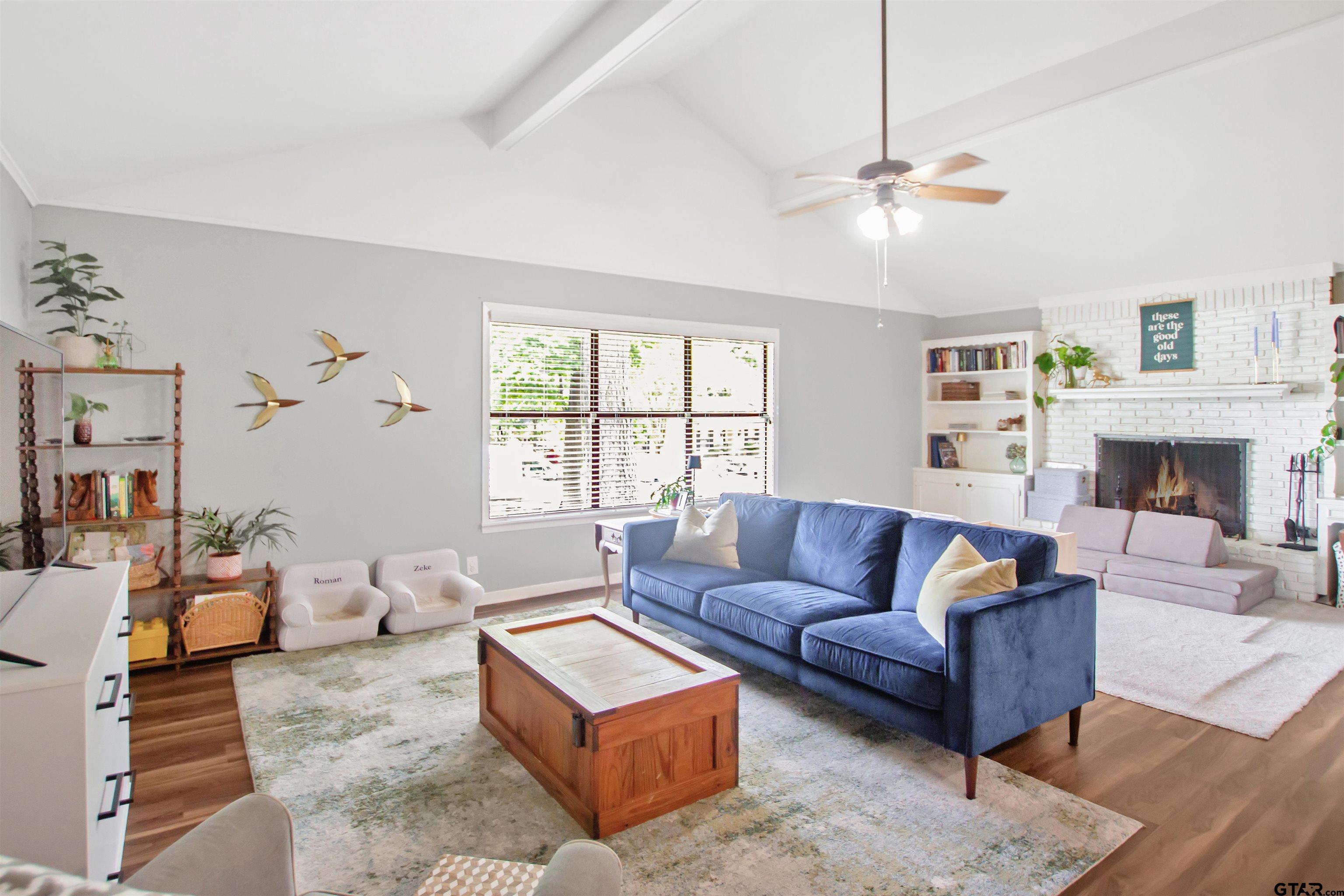 1908 Waunell Drive Tyler, TX 75701 - Photo 2 of 39 a living room with fireplace furniture and a large window