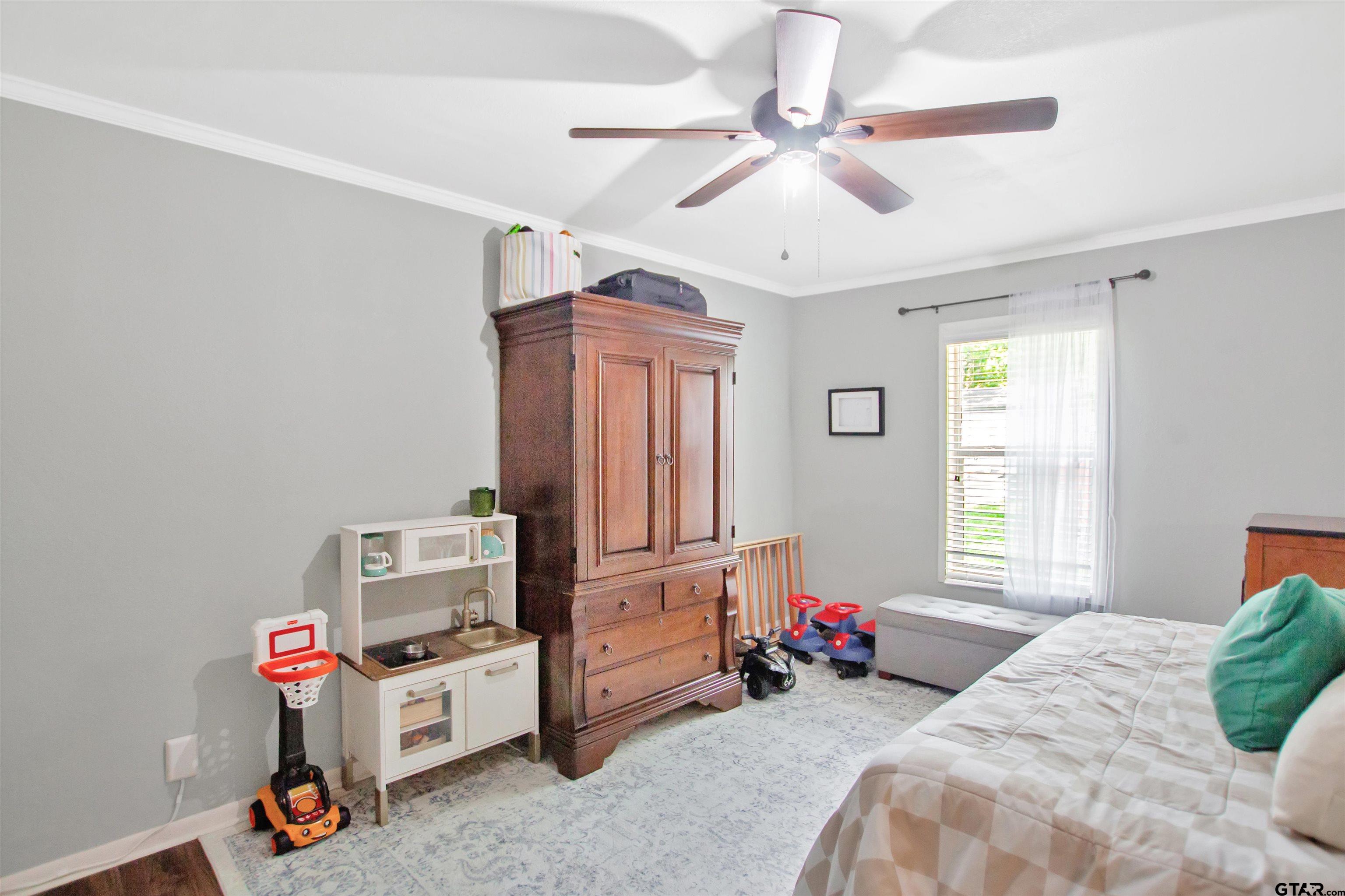 1908 Waunell Drive Tyler, TX 75701 - Photo 23 of 39 a bedroom with furniture and a window