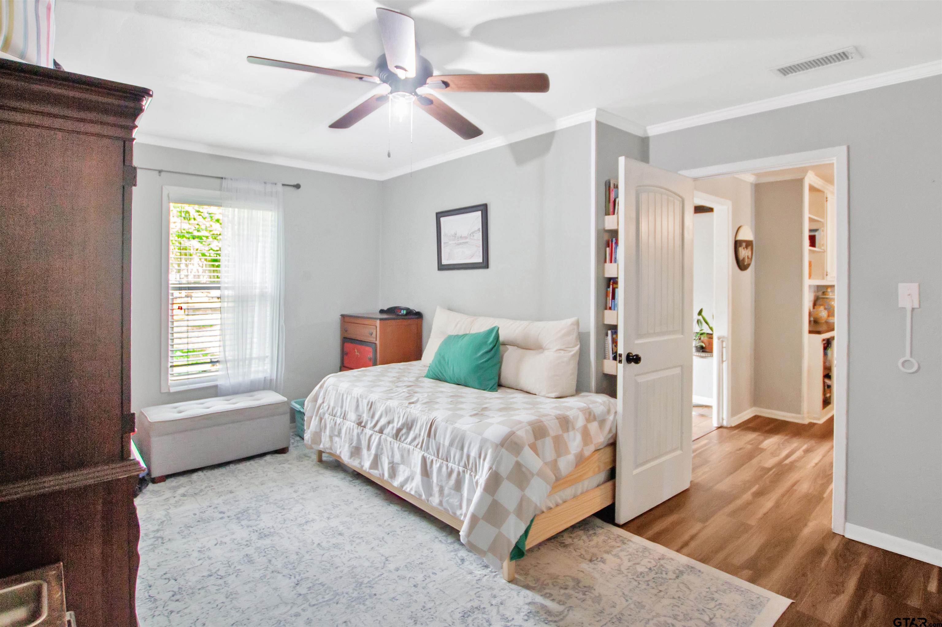 1908 Waunell Drive Tyler, TX 75701 - Photo 24 of 39 a bedroom with a bed and a window