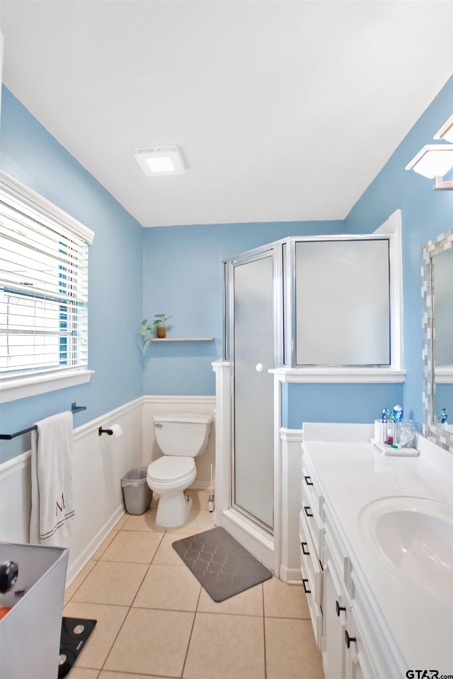 1908 Waunell Drive Tyler, TX 75701 - Photo 29 of 39 a bathroom with a bathtub sink and mirror