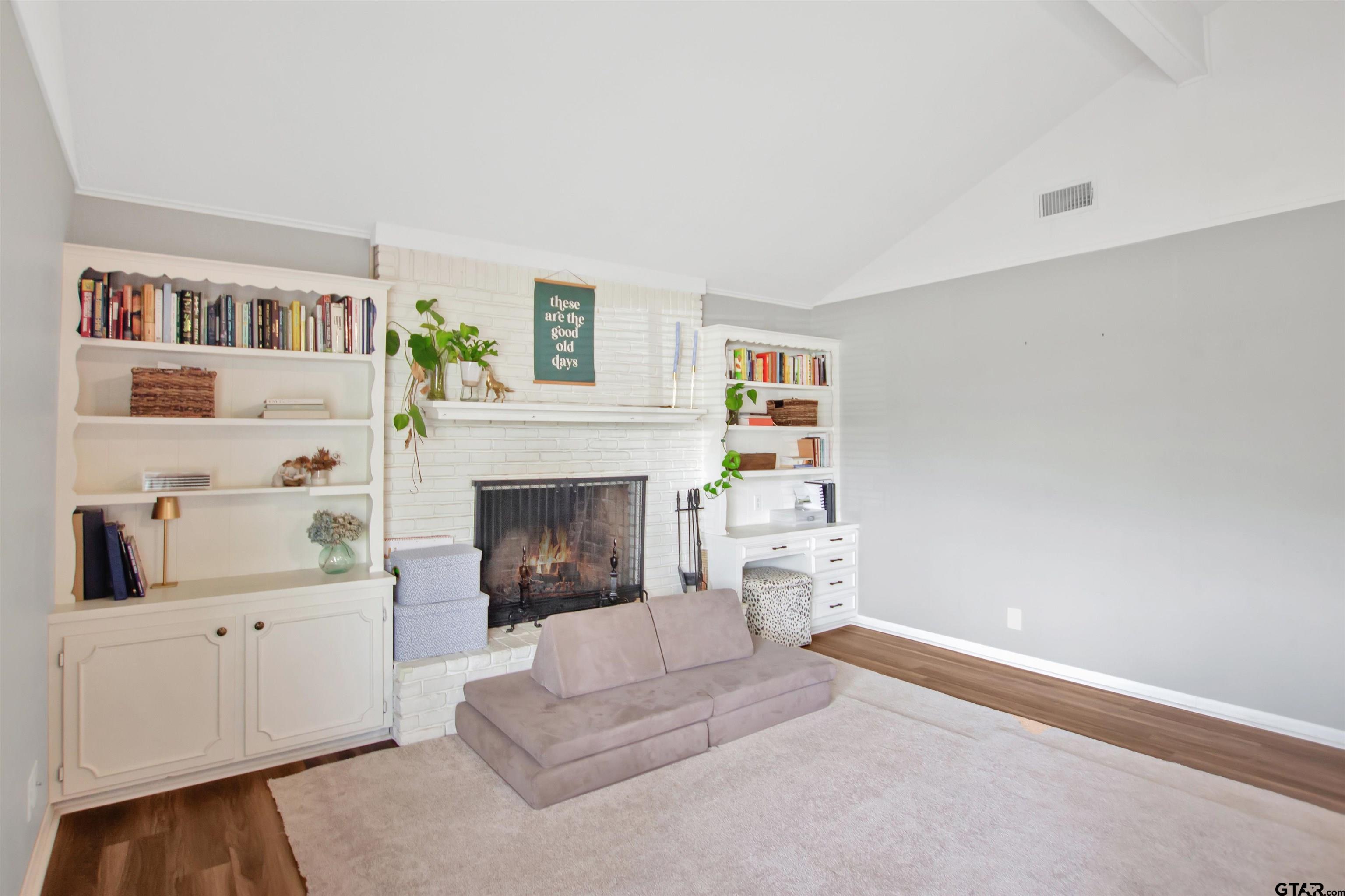 1908 Waunell Drive Tyler, TX 75701 - Photo 4 of 39 a living room with furniture and a fireplace