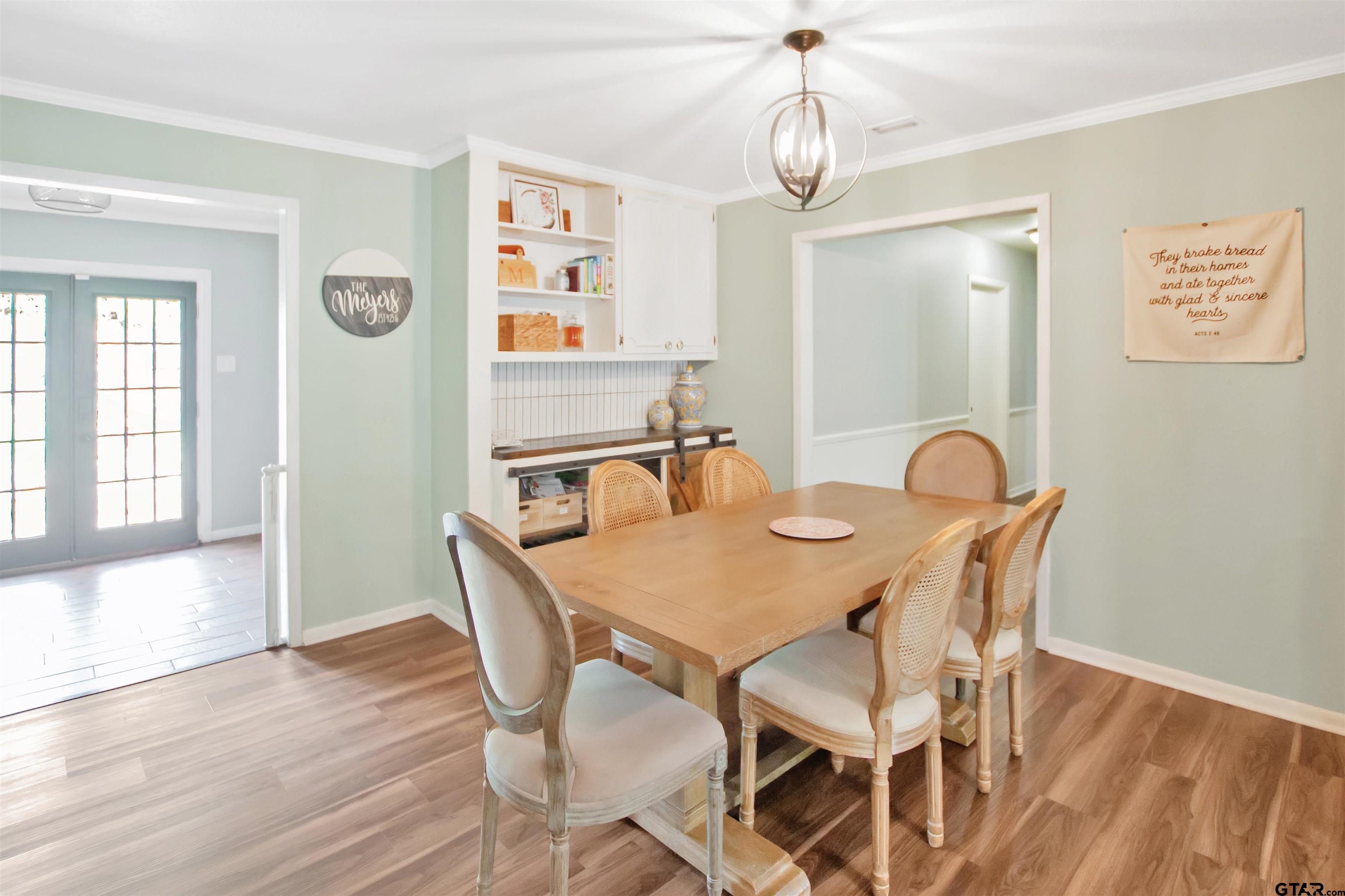 1908 Waunell Drive Tyler, TX 75701 - Photo 8 of 39 a view of a dining room with furniture window and wooden floor