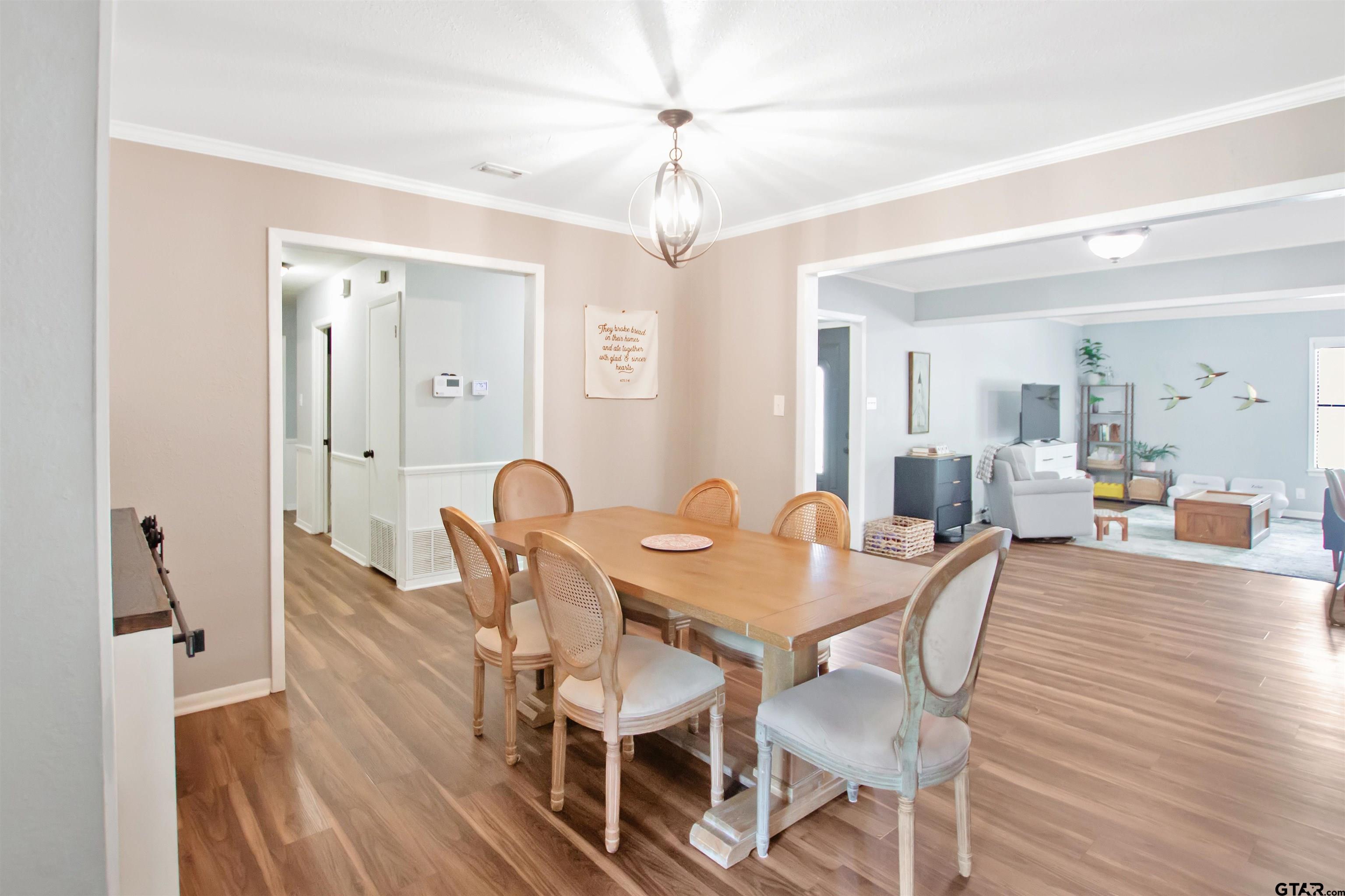 1908 Waunell Drive Tyler, TX 75701 - Photo 10 of 39 a view of a dining room with furniture and wooden floor