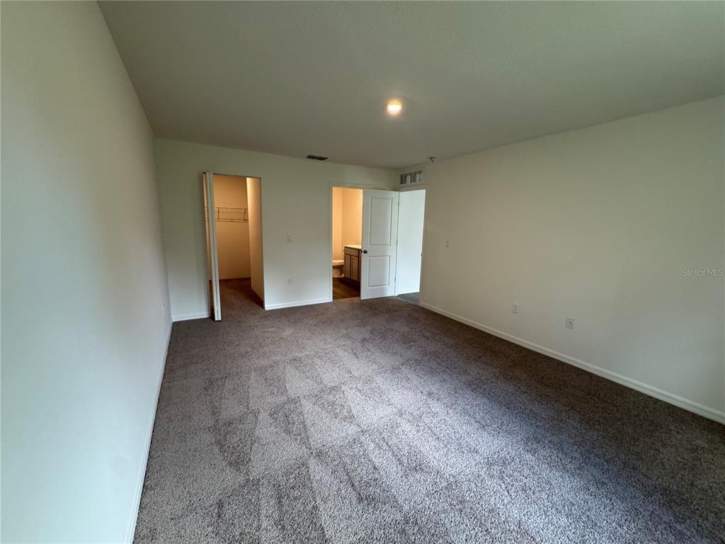 6000 East Oneida Street Inverness, FL 34452 - Photo 11 of 32 an empty room with windows and closet