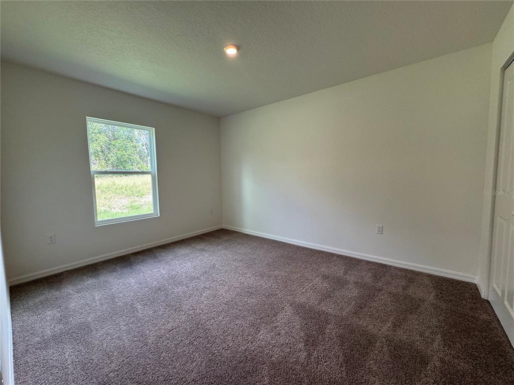 6000 East Oneida Street Inverness, FL 34452 - Photo 16 of 32 an empty room with a window