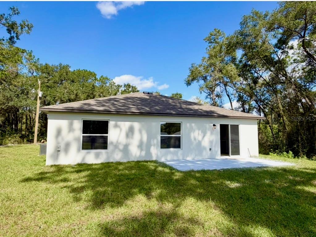 6000 East Oneida Street Inverness, FL 34452 - Photo 2 of 32 a front view of house with yard and trees